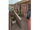 Wooden deck featuring potted plants and views of the building at 1920 E Edgewood Dr # T6, Lakeland, FL 33803