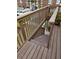 Wooden deck with stairs, and plants in pots on the deck at 1920 E Edgewood Dr # T6, Lakeland, FL 33803
