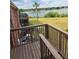 This outdoor deck boasts serene lake views, perfect for relaxation and enjoying nature at 1920 E Edgewood Dr # T6, Lakeland, FL 33803