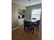Dining room area features built-in cabinets, a window and hardwood flooring at 1920 E Edgewood Dr # T6, Lakeland, FL 33803