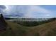 Panoramic lake view showcasing waterfront serenity, lush vegetation, and expansive sky at 1920 E Edgewood Dr # T6, Lakeland, FL 33803