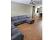 Living room featuring a spacious seating area, wood floors and ceiling fan at 1920 E Edgewood Dr # T6, Lakeland, FL 33803