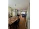 Combination living room and dining area with hardwood floors and neutral paint at 1920 E Edgewood Dr # T6, Lakeland, FL 33803