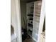 Walk-in pantry with several shelves, ideal for food storage, cookware, and kitchen appliances at 1920 E Edgewood Dr # T6, Lakeland, FL 33803