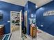 Bathroom leads to bedroom; features textured walls and tile flooring at 2033 Normandy Heights Dr, Winter Haven, FL 33880