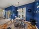 Dining room area showcasing lots of blue decor, a table and natural light at 2033 Normandy Heights Dr, Winter Haven, FL 33880