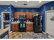 Kitchen with black appliances, wood cabinets, and an eat-in area visible in the background at 2033 Normandy Heights Dr, Winter Haven, FL 33880