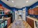 View of the kitchen showcasing ample counter space, wood cabinets, and a cozy aesthetic at 2033 Normandy Heights Dr, Winter Haven, FL 33880
