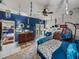 Spacious main bedroom featuring hardwood furniture, a ceiling fan, and unique decorations at 2033 Normandy Heights Dr, Winter Haven, FL 33880