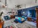 Stylish main bedroom featuring unique decor, a ceiling fan, and a cozy atmosphere at 2033 Normandy Heights Dr, Winter Haven, FL 33880