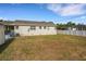 Expansive backyard view, highlighting the home's exterior, lawn space, and potential for outdoor activities at 2814 Coventry Ave, Lakeland, FL 33803