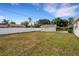 Large backyard featuring white privacy fence and shed at 2814 Coventry Ave, Lakeland, FL 33803