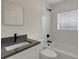 Newly renovated bathroom features sleek, modern finishes and fixtures in neutral colors at 2814 Coventry Ave, Lakeland, FL 33803