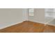Bedroom with hardwood floors, white trim, and large closet at 2814 Coventry Ave, Lakeland, FL 33803