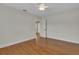 Spacious bedroom featuring beautiful hardwood floors and a ceiling fan at 2814 Coventry Ave, Lakeland, FL 33803