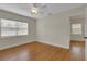 Bright bedroom featuring hardwood floors, a ceiling fan, and plenty of natural light at 2814 Coventry Ave, Lakeland, FL 33803