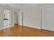 Bedroom boasts gleaming hardwood floors and attached bathroom at 2814 Coventry Ave, Lakeland, FL 33803