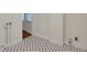 Unfinished laundry room with black and white patterned floors at 2814 Coventry Ave, Lakeland, FL 33803