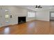 Sun-filled living room boasts hardwood floors and fireplace at 2814 Coventry Ave, Lakeland, FL 33803