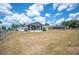 Large grassy backyard with patio and fencing, perfect for recreation at 3226 Cherry Hill S Cir, Lakeland, FL 33810