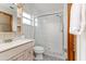 Traditional bathroom with a walk-in shower and classic fixtures at 3226 Cherry Hill S Cir, Lakeland, FL 33810