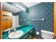 Vintage bathroom with green countertops and wallpaper at 3226 Cherry Hill S Cir, Lakeland, FL 33810