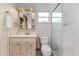 Charming bathroom with floral wallpaper, vanity, and a walk-in shower at 3226 Cherry Hill S Cir, Lakeland, FL 33810
