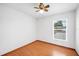 Empty bedroom with hardwood floors and a view of the front yard at 3226 Cherry Hill S Cir, Lakeland, FL 33810