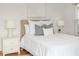Bedroom with hardwood floors and two bedside tables with lamps at 3226 Cherry Hill S Cir, Lakeland, FL 33810