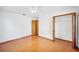 Bright bedroom features wood floors, closet and an adjacent room at 3226 Cherry Hill S Cir, Lakeland, FL 33810