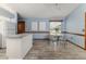 Breakfast nook with wood-style flooring, white table, and light-blue walls at 3226 Cherry Hill S Cir, Lakeland, FL 33810