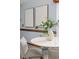 Bright breakfast nook featuring a round table, gray chairs, and two framed artworks at 3226 Cherry Hill S Cir, Lakeland, FL 33810