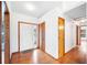 A bright entryway featuring wood floors, closet and sidelight door at 3226 Cherry Hill S Cir, Lakeland, FL 33810