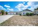 Inviting home featuring an attached garage, well-maintained lawn, and concrete driveway at 3226 Cherry Hill S Cir, Lakeland, FL 33810