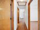 Hallway with wood floors and views of other rooms at 3226 Cherry Hill S Cir, Lakeland, FL 33810