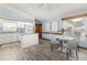 Open concept kitchen with modern finishes and an adjacent dining area at 3226 Cherry Hill S Cir, Lakeland, FL 33810