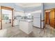 Bright eat-in kitchen with an island, white cabinets and light blue walls at 3226 Cherry Hill S Cir, Lakeland, FL 33810