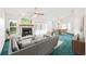 Cozy living room with fireplace, ceiling fan, and dining area at 3226 Cherry Hill S Cir, Lakeland, FL 33810