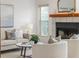 Inviting living room featuring a fireplace, comfortable seating, and stylish decor accents at 3226 Cherry Hill S Cir, Lakeland, FL 33810