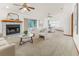 Bright living room with fireplace, dining area, and access to outdoor space at 3226 Cherry Hill S Cir, Lakeland, FL 33810