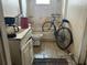 Bathroom with a bicycle in the tub, needs updating and decluttering at 445 Choctaw Ave, Lakeland, FL 33815