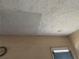 Textured ceiling with water stains and visible damage needing repair at 445 Choctaw Ave, Lakeland, FL 33815