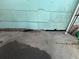 Exterior damage is visible on the siding and foundation, needs immediate attention at 445 Choctaw Ave, Lakeland, FL 33815