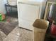Laundry area with damaged floor near a washing machine at 445 Choctaw Ave, Lakeland, FL 33815
