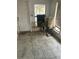 Enclosed porch with tile flooring needs repair and updating at 445 Choctaw Ave, Lakeland, FL 33815