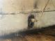 Close-up of a damaged wall with exposed wiring and decaying paint at 445 Choctaw Ave, Lakeland, FL 33815