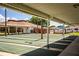 View of the community shuffleboard courts with multiple lanes and covered seating area at 4963 Colonnades Club Blvd, Lakeland, FL 33811