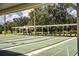 View of the community shuffleboard courts showing multiple lanes and a covered seating area at 4963 Colonnades Club Blvd, Lakeland, FL 33811