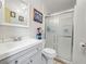Bathroom featuring vanity sink with white countertops and shower with glass door at 5027 Forest Crest Dr, Lakeland, FL 33810