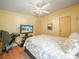 Bedroom featuring ceiling fan and wall mounted TV at 5027 Forest Crest Dr, Lakeland, FL 33810